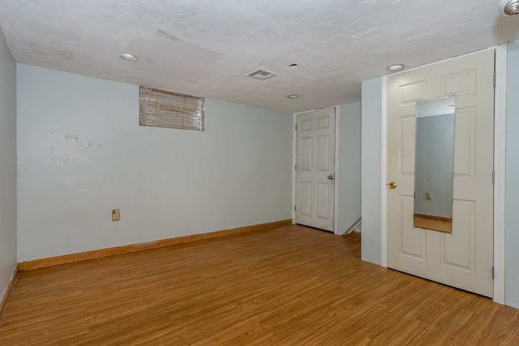 59 Weyham Road Weymouth, MA 02191 - Photo 15 of 18 a view of an empty room with wooden floor and closet