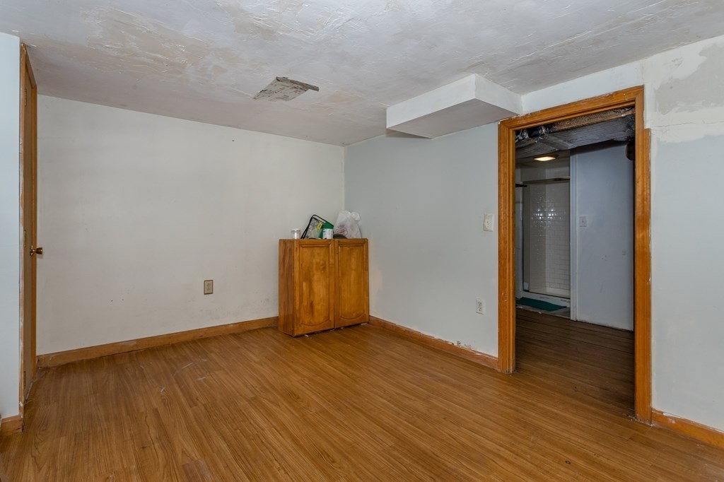 59 Weyham Road Weymouth, MA 02191 - Photo 16 of 18 a view of an empty room with wooden floor and closet