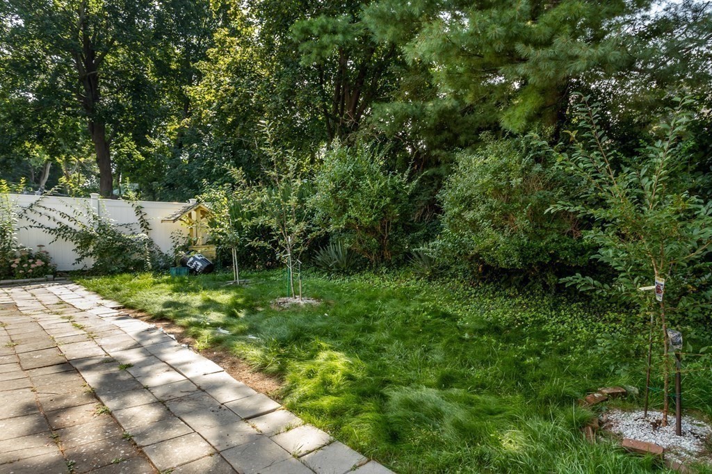 59 Weyham Road Weymouth, MA 02191 - Photo 18 of 18 a backyard of a house with lots of green space