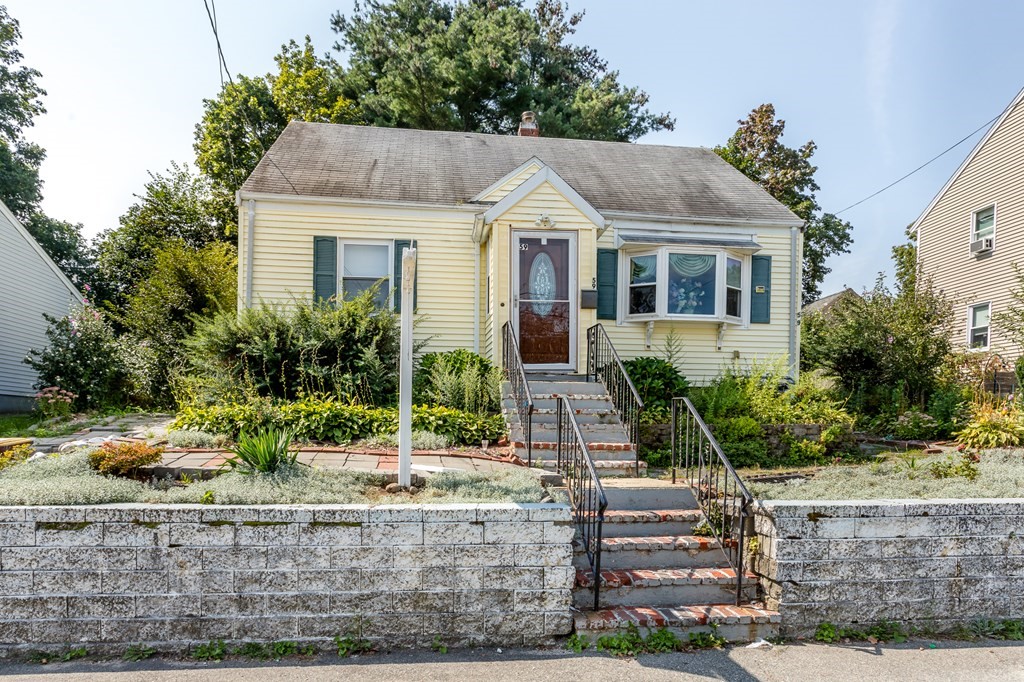 59 Weyham Road Weymouth, MA 02191 - Photo 2 of 18 a front view of house with yard and green space