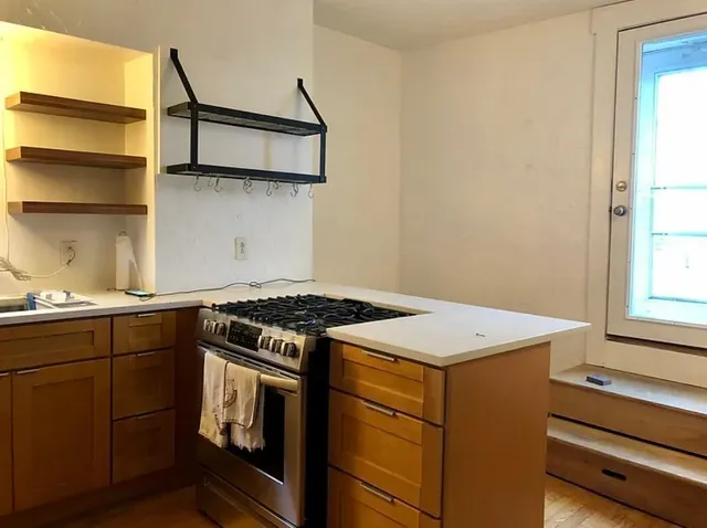 a kitchen with a stove and a microwave