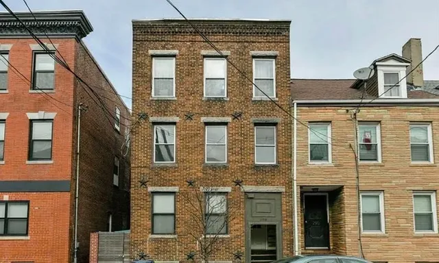a front view of a multi story residential apartment building