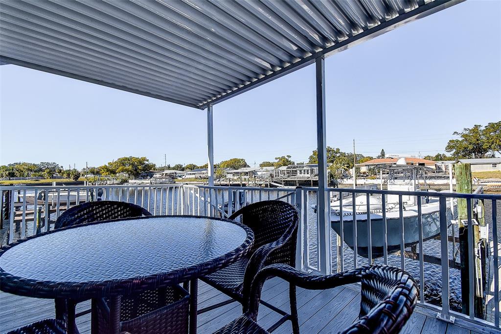 5309 Boardwalk Street Holiday, FL 34690 - Photo 23 of 50 a view of a chairs and table in the balcony