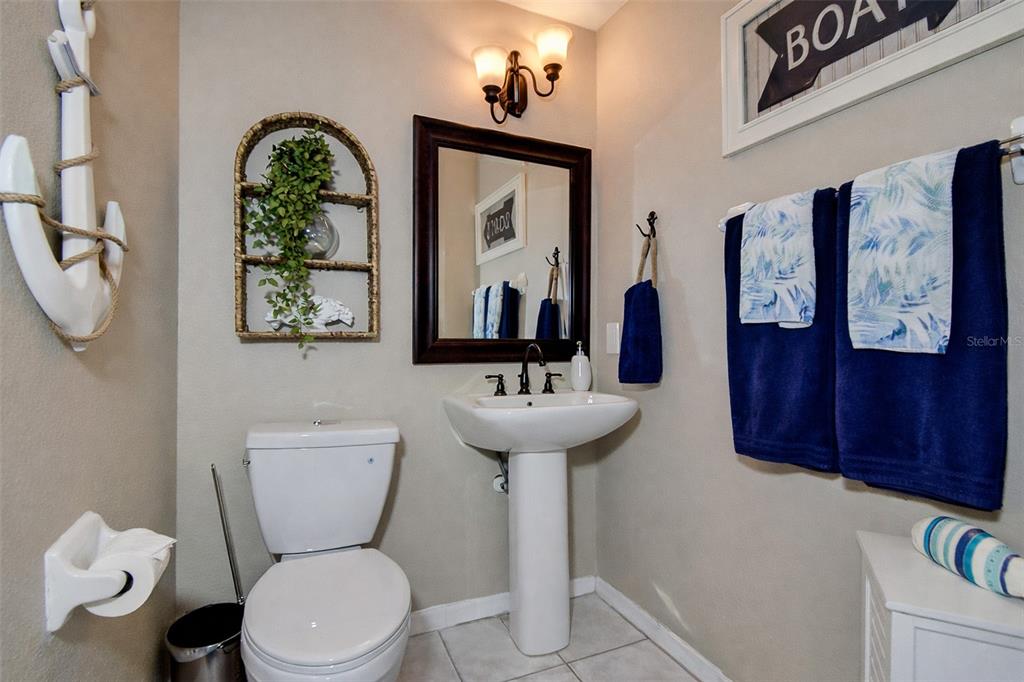 5309 Boardwalk Street Holiday, FL 34690 - Photo 24 of 50 a bathroom with a toilet sink and mirror