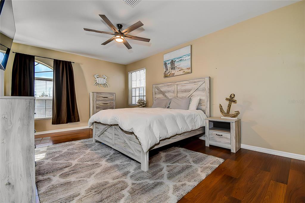 5309 Boardwalk Street Holiday, FL 34690 - Photo 25 of 50 a bedroom with a bed and window