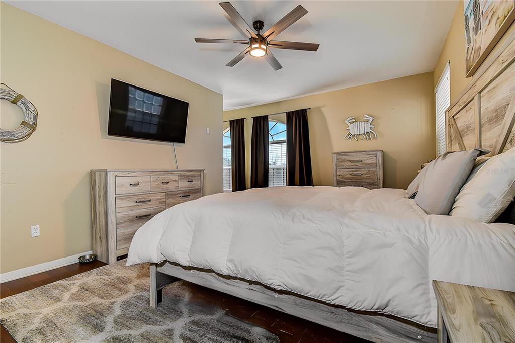 5309 Boardwalk Street Holiday, FL 34690 - Photo 26 of 50 a bedroom with a bed and a flat screen tv