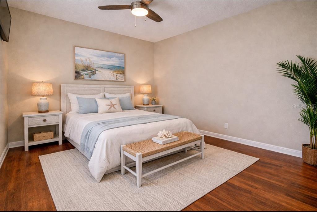 5309 Boardwalk Street Holiday, FL 34690 - Photo 31 of 50 a bedroom with a bed and a lamp