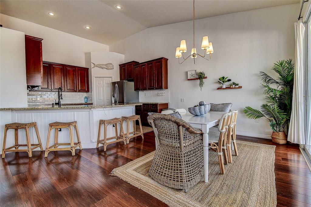 5309 Boardwalk Street Holiday, FL 34690 - Photo 8 of 50 a view of a dining room with furniture wooden floor and chandelier