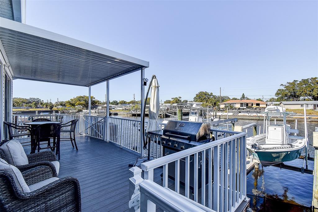 5309 Boardwalk Street Holiday, FL 34690 - Photo 9 of 50 a view of a chairs and table in the balcony