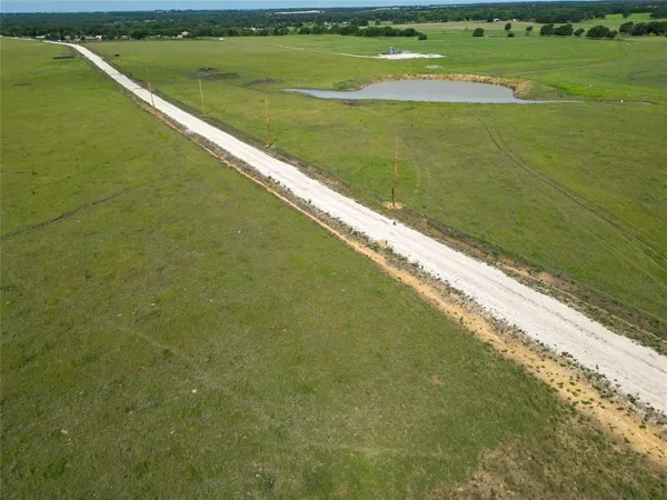 a view of a lake from a yard