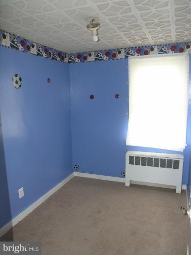 3702 Greenvale Road Baltimore, MD 21229 - Photo 2 of 15 a view of an empty room with a window