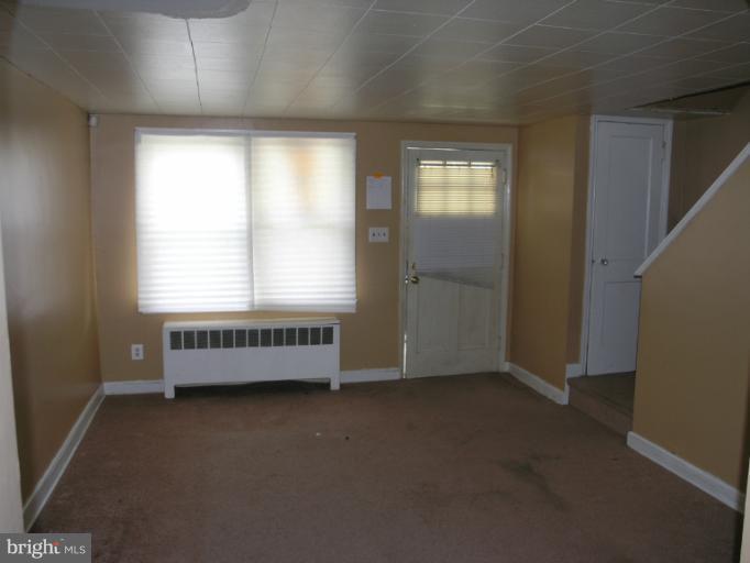 3702 Greenvale Road Baltimore, MD 21229 - Photo 12 of 15 an empty room with windows
