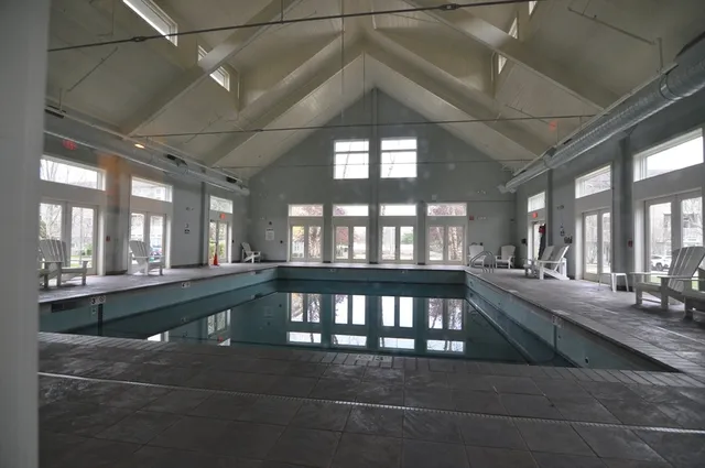 a view of a living room and chandelier