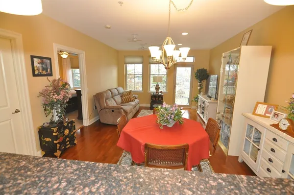 a view of a livingroom with furniture and chandelier