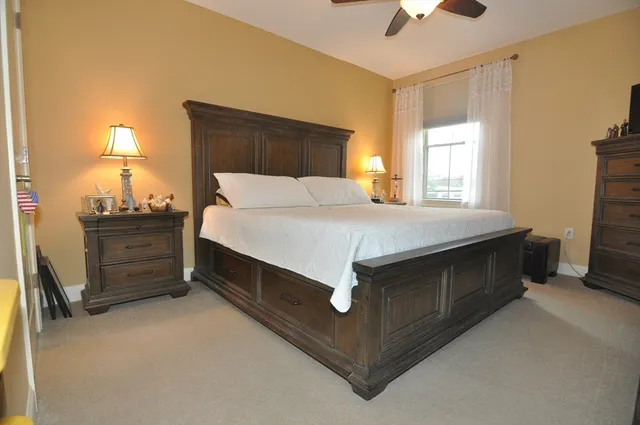 a bed room with a bed and a lamp