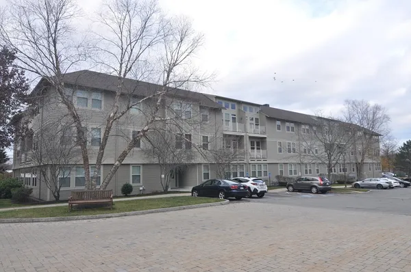 a view of street with parked cars