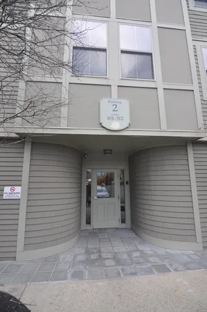 a front view of a house with garage