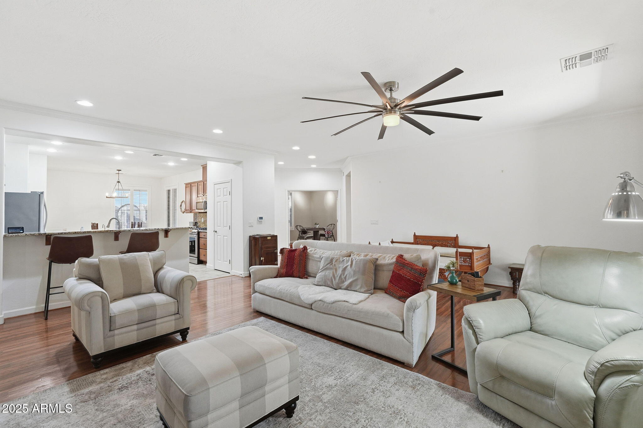 5161 North Scottsdale Road Eloy, AZ 85131 - Photo 12 of 58 a living room with furniture and a chandelier