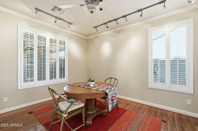 a view of a dining room with furniture and window