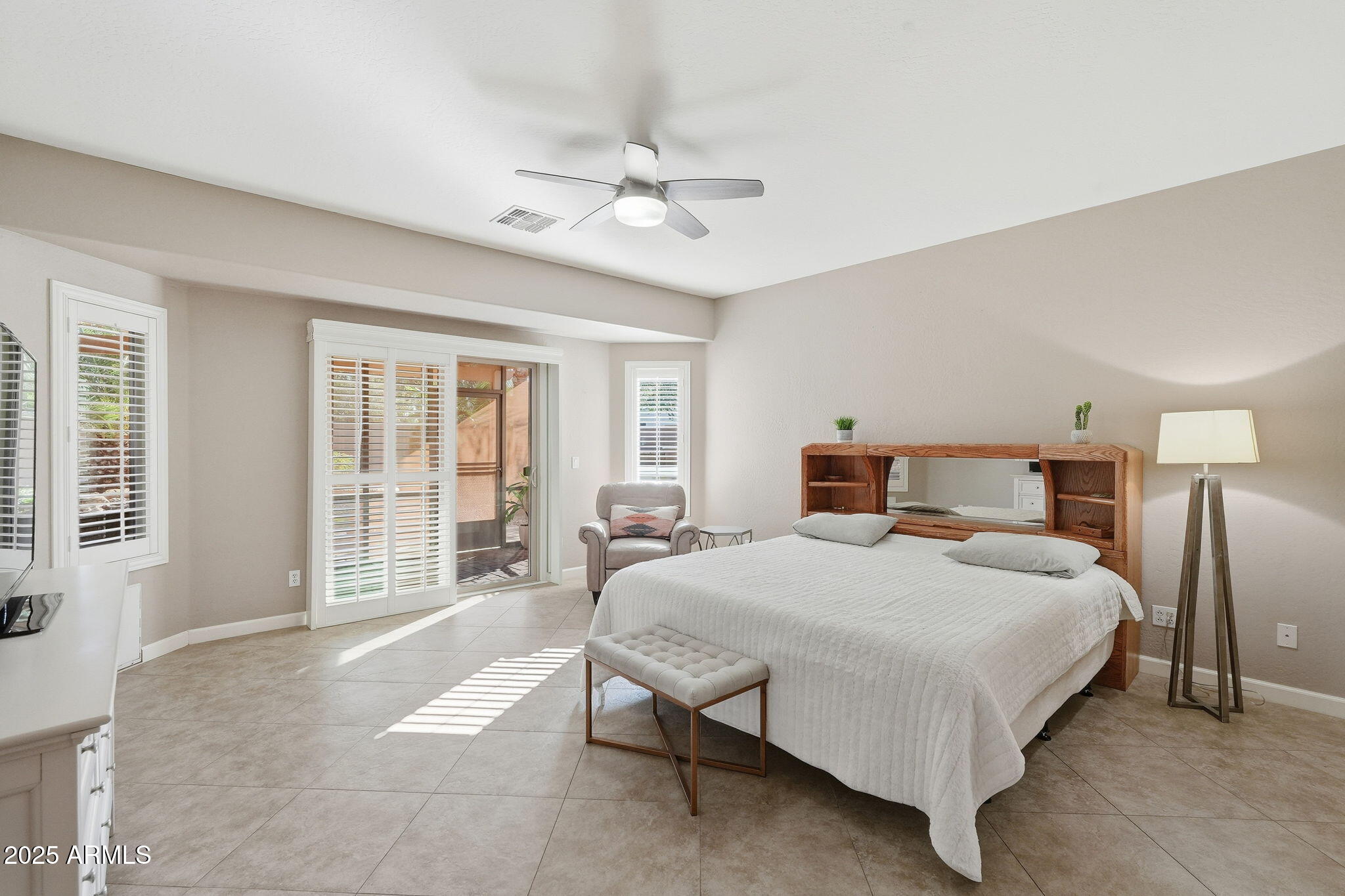 5161 North Scottsdale Road Eloy, AZ 85131 - Photo 22 of 58 a bedroom with a large bed and windows