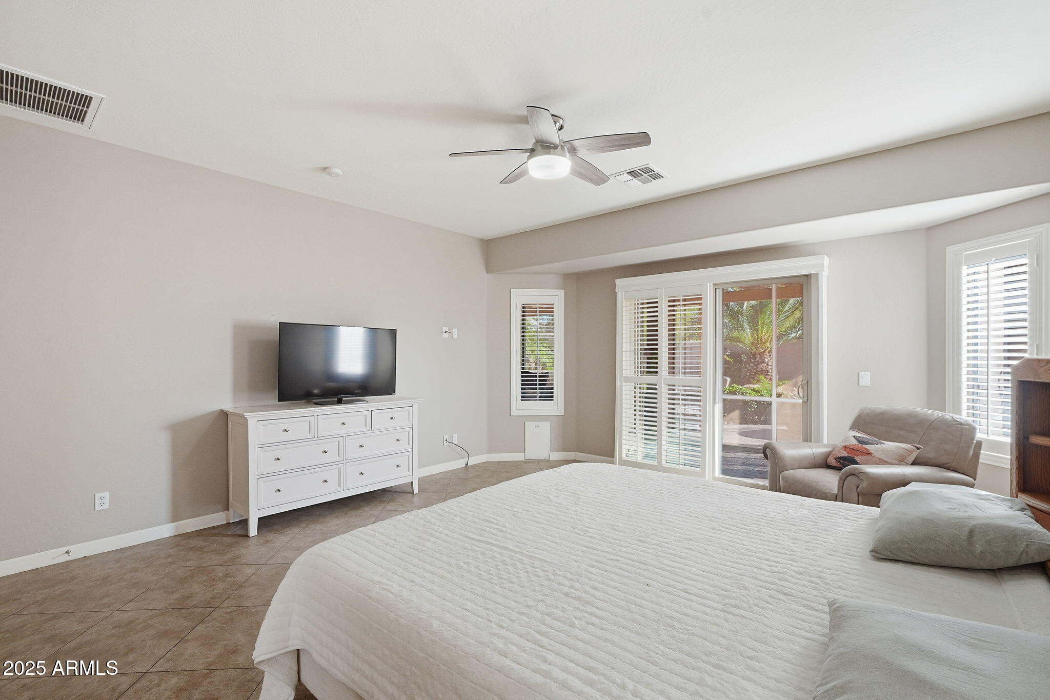5161 North Scottsdale Road Eloy, AZ 85131 - Photo 24 of 58 a bedroom with a bed and a flat screen tv