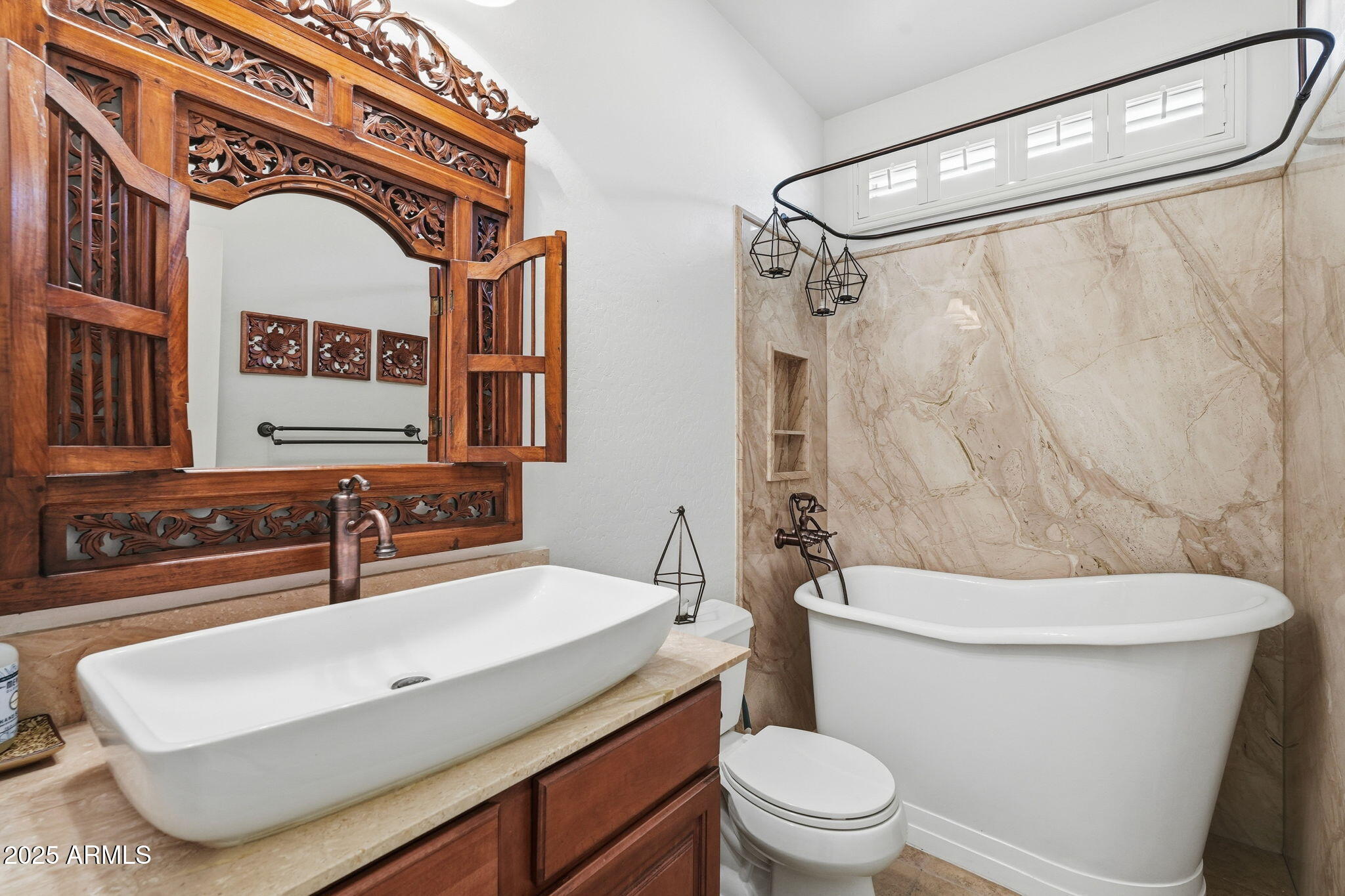 5161 North Scottsdale Road Eloy, AZ 85131 - Photo 30 of 58 a bathroom with a sink a mirror and a toilet