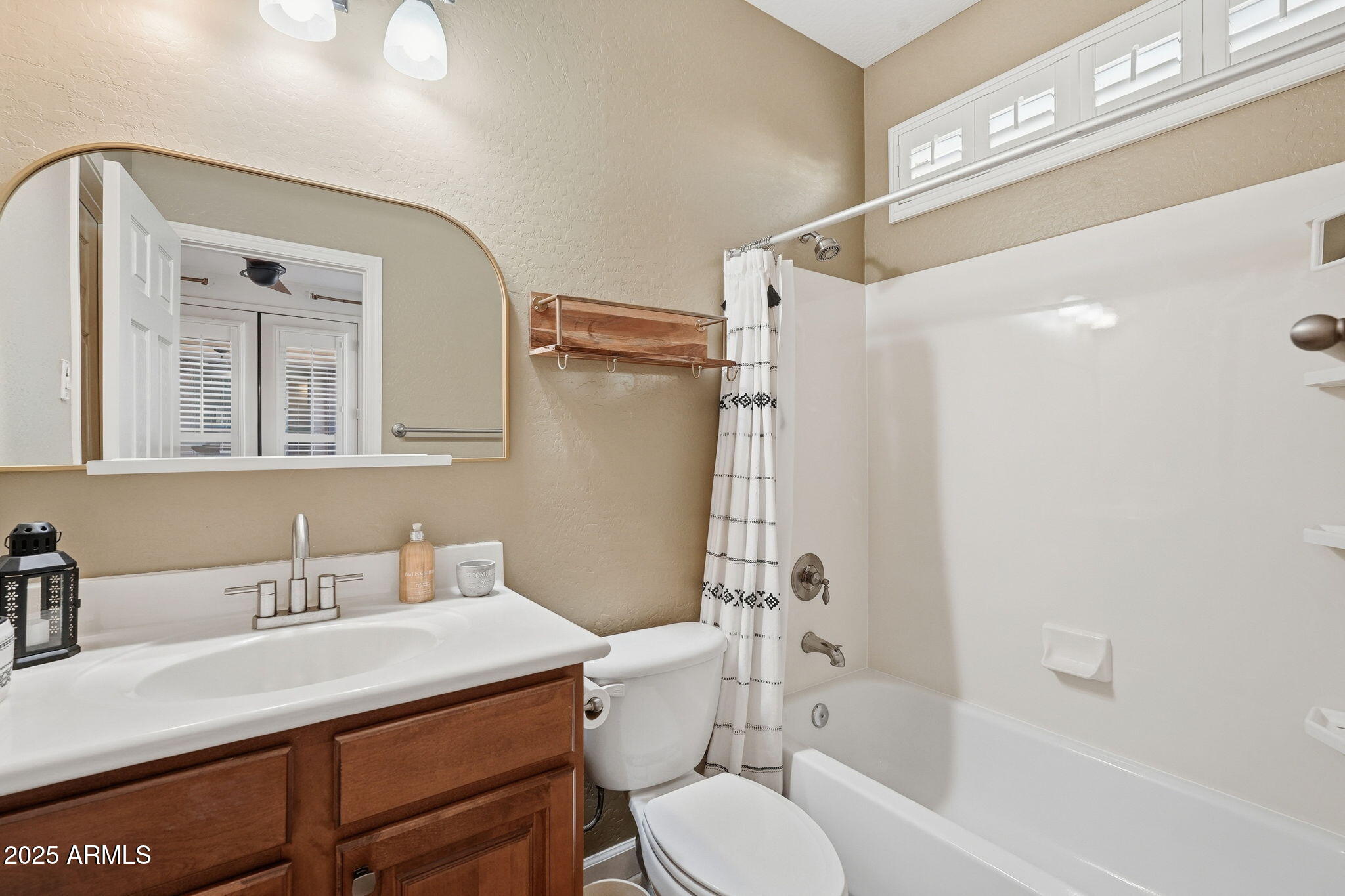 5161 North Scottsdale Road Eloy, AZ 85131 - Photo 8 of 58 a bathroom with a sink toilet vanity and shower