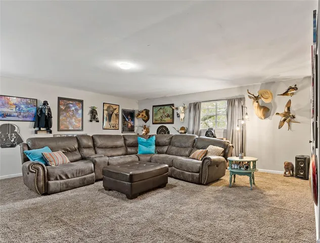 a living room with furniture and a table