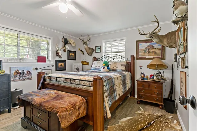 a bedroom with bed and windows