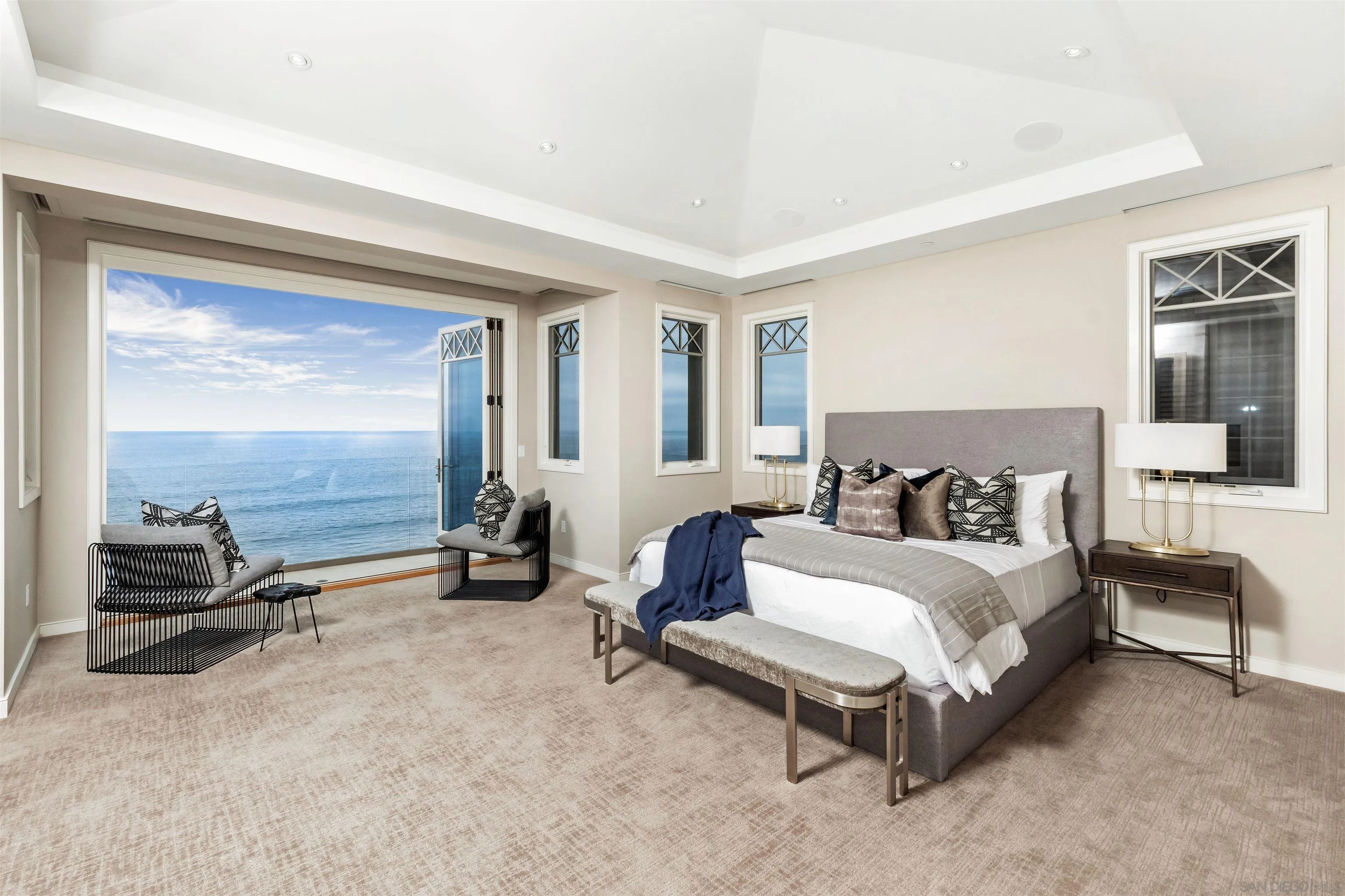 824 Neptune Avenue Encinitas, CA 92024 - Photo 13 of 33 a spacious bedroom with a bed and a walk in closet