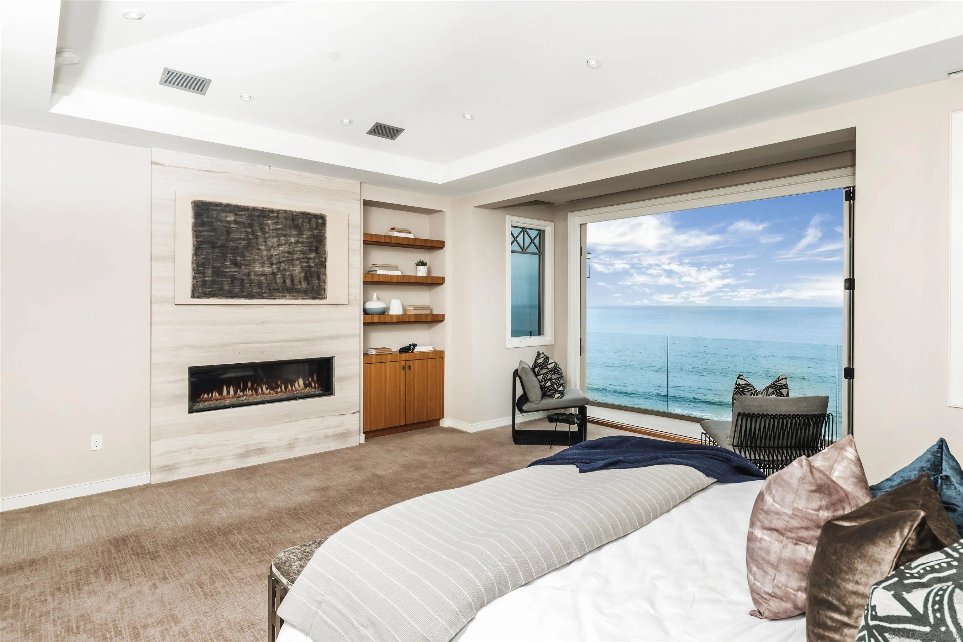 824 Neptune Avenue Encinitas, CA 92024 - Photo 14 of 33 a bedroom with furniture and a fireplace