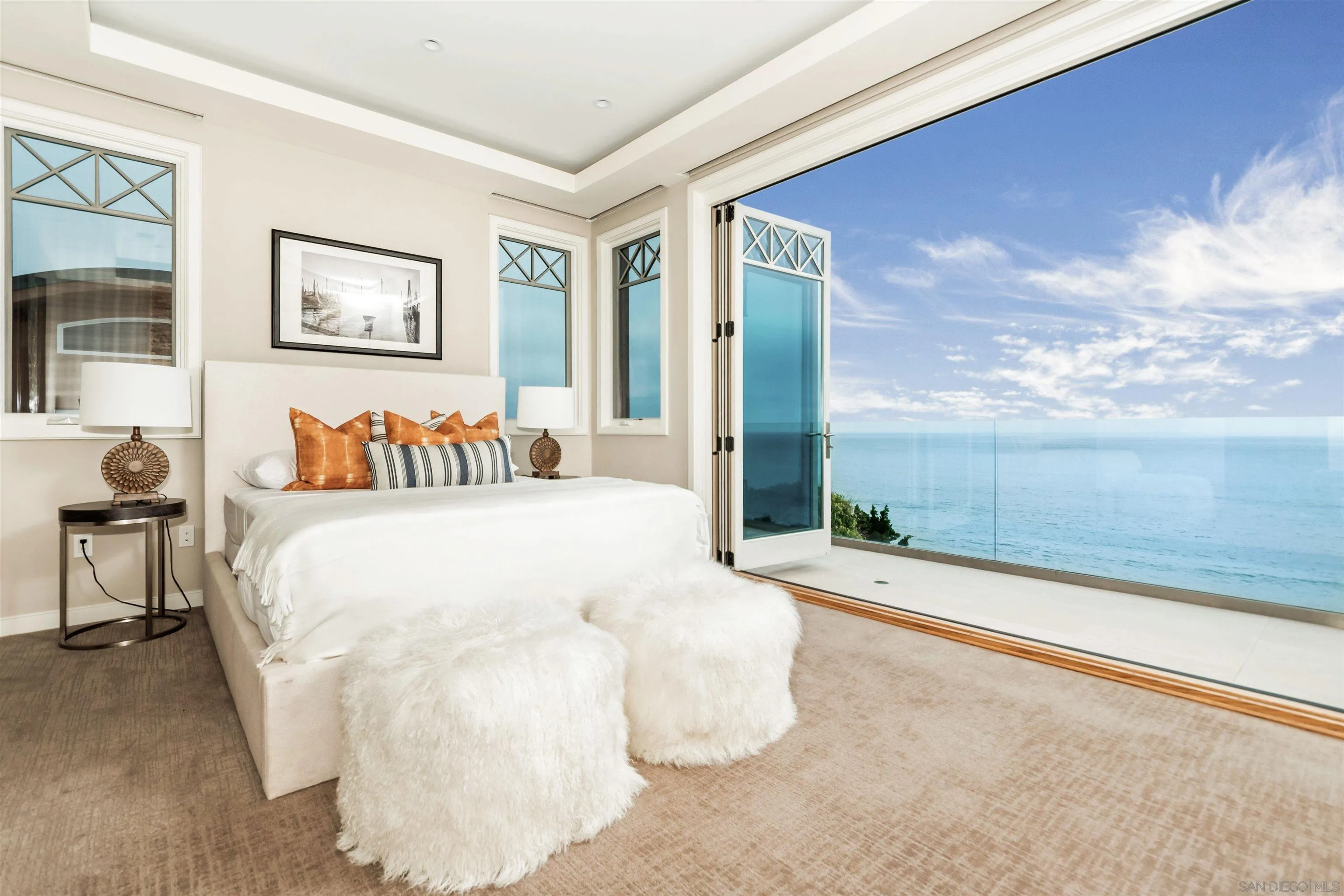 824 Neptune Avenue Encinitas, CA 92024 - Photo 18 of 33 a spacious bedroom with a bed and a large window