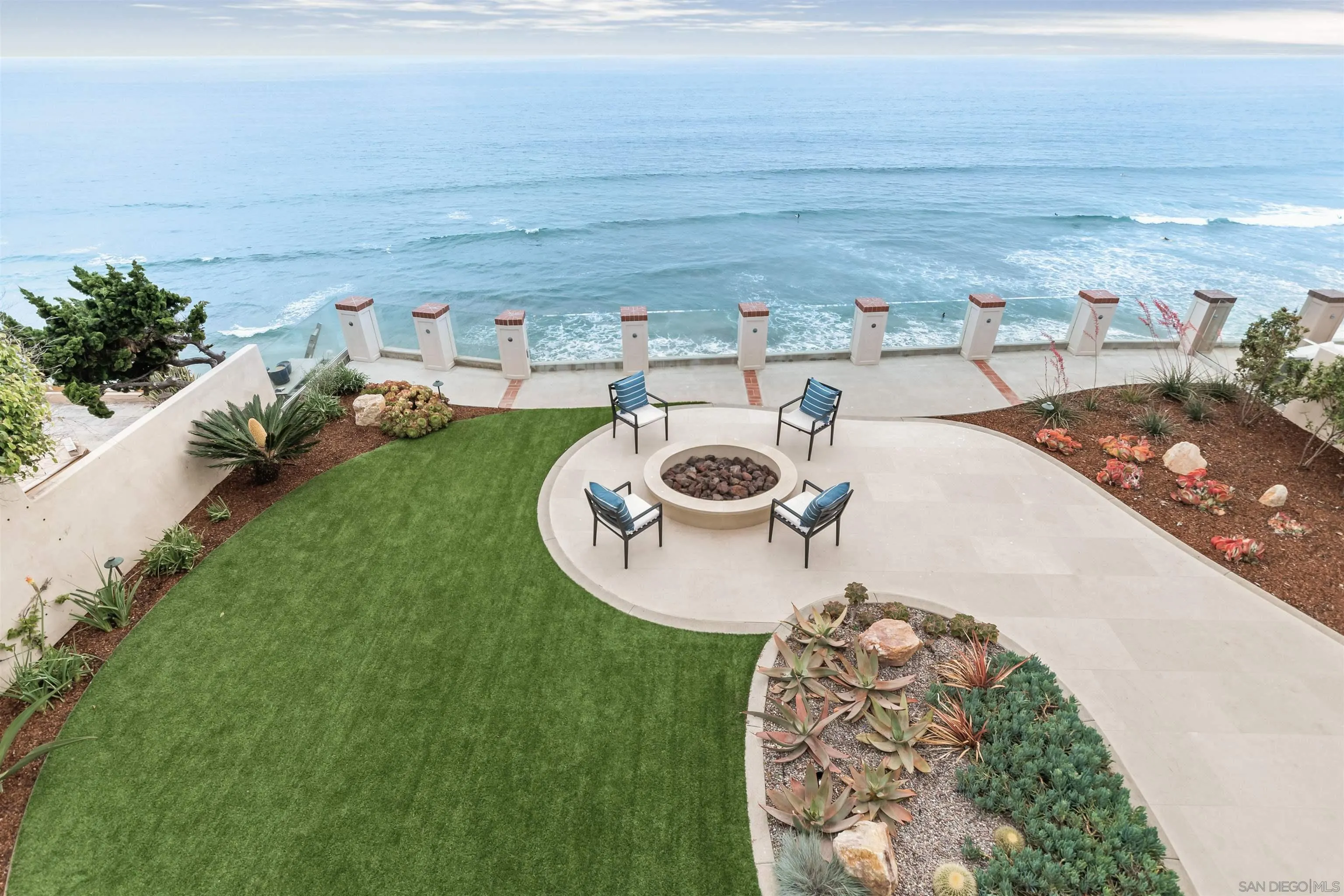 824 Neptune Avenue Encinitas, CA 92024 - Photo 22 of 33 a view of a backyard with table and chairs
