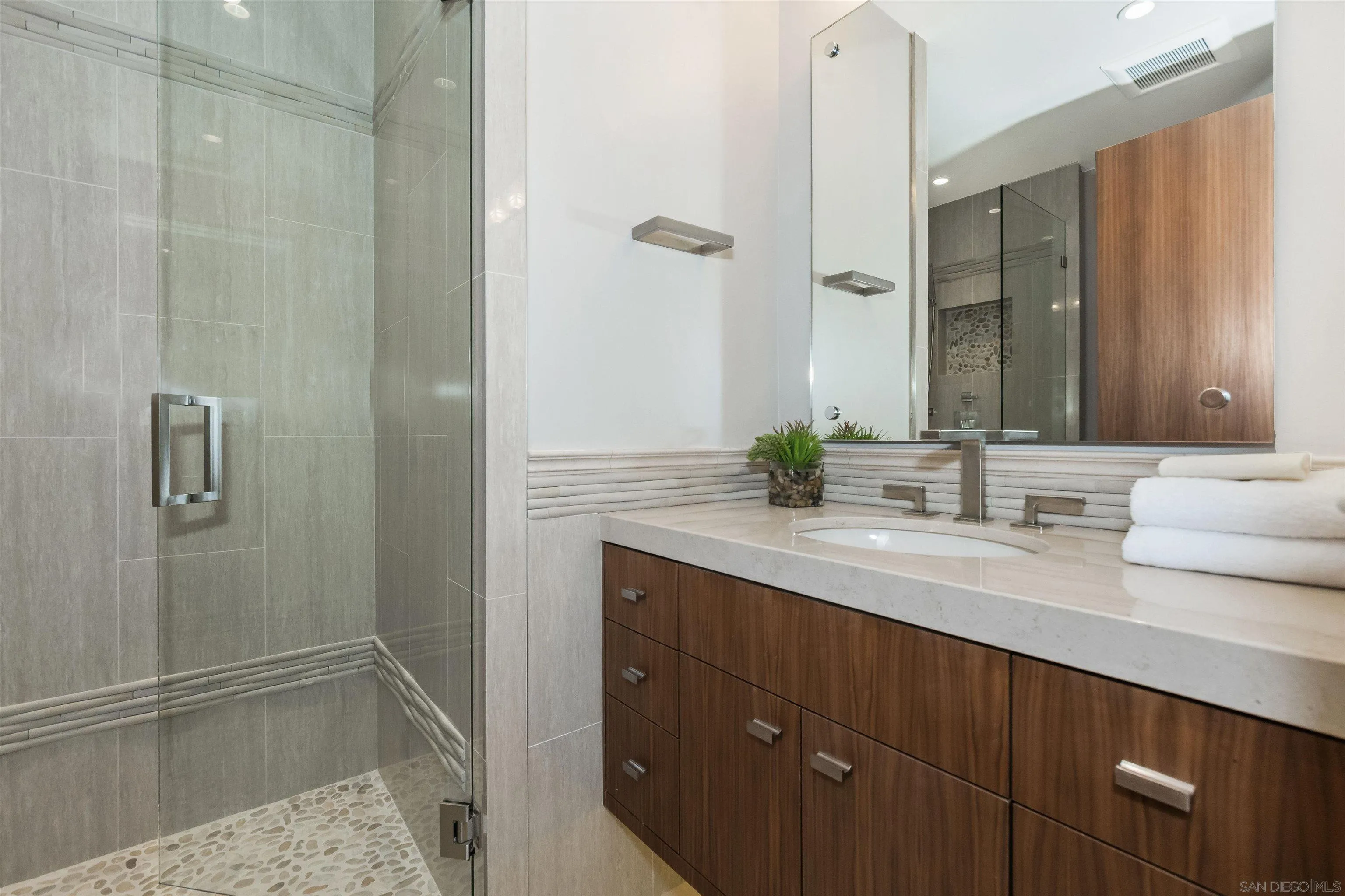824 Neptune Avenue Encinitas, CA 92024 - Photo 27 of 33 a bathroom with a granite countertop sink and a mirror