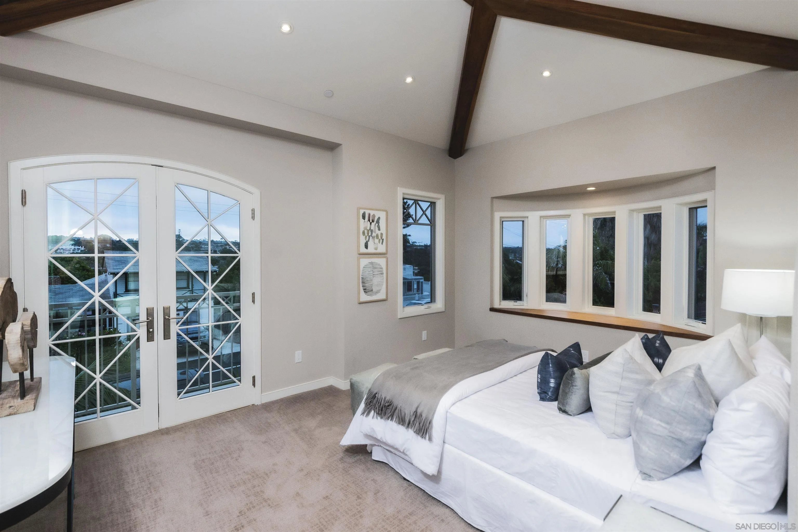 824 Neptune Avenue Encinitas, CA 92024 - Photo 29 of 33 a spacious bedroom with a bed and a window