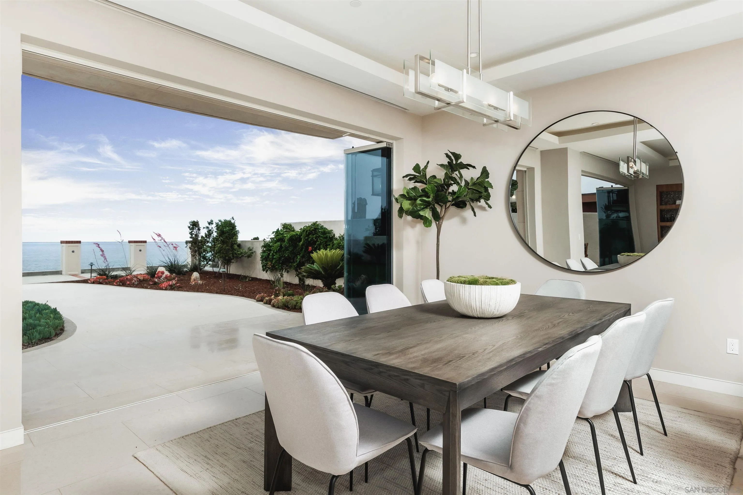 824 Neptune Avenue Encinitas, CA 92024 - Photo 7 of 33 a view of a dining room with furniture and chandelier