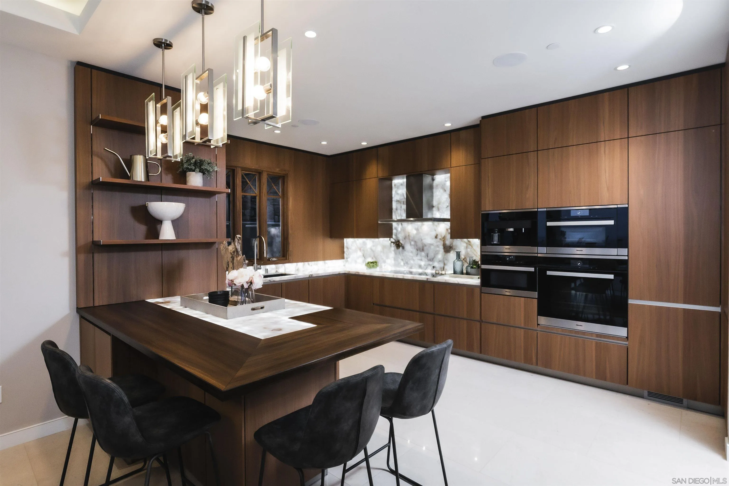 824 Neptune Avenue Encinitas, CA 92024 - Photo 9 of 33 a kitchen with a dining table cabinets and appliances