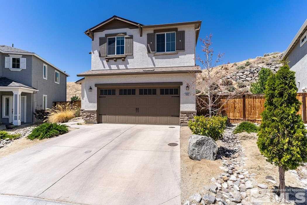 1863 Star Bright Way Reno, NV 89523 - Photo 1 of 22 a front view of a house with a yard