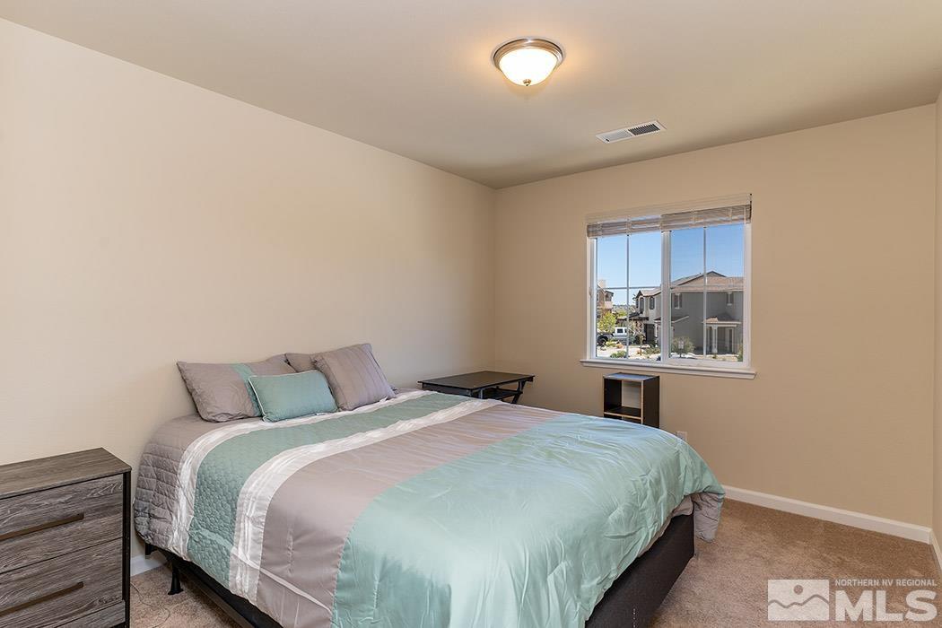 1863 Star Bright Way Reno, NV 89523 - Photo 14 of 22 a bedroom with a bed and window