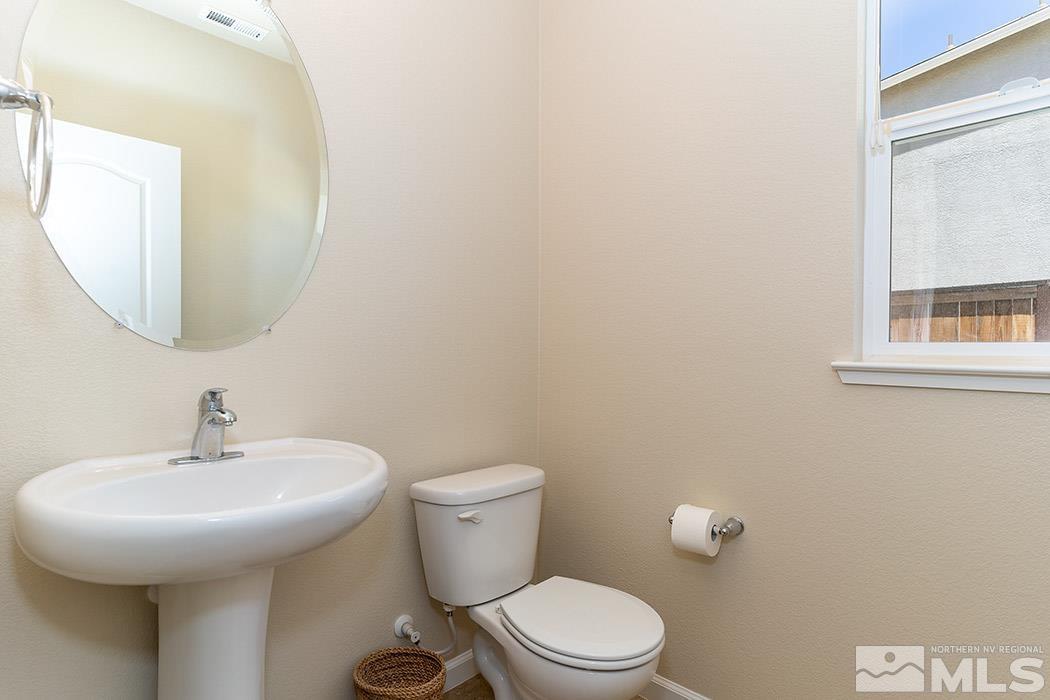 1863 Star Bright Way Reno, NV 89523 - Photo 17 of 22 a bathroom with a toilet a sink and mirror