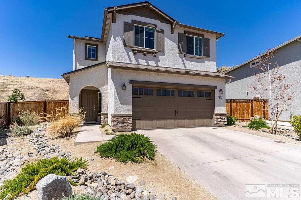 1863 Star Bright Way Reno, NV 89523 - Photo 2 of 22 a front view of a house with a yard and garage
