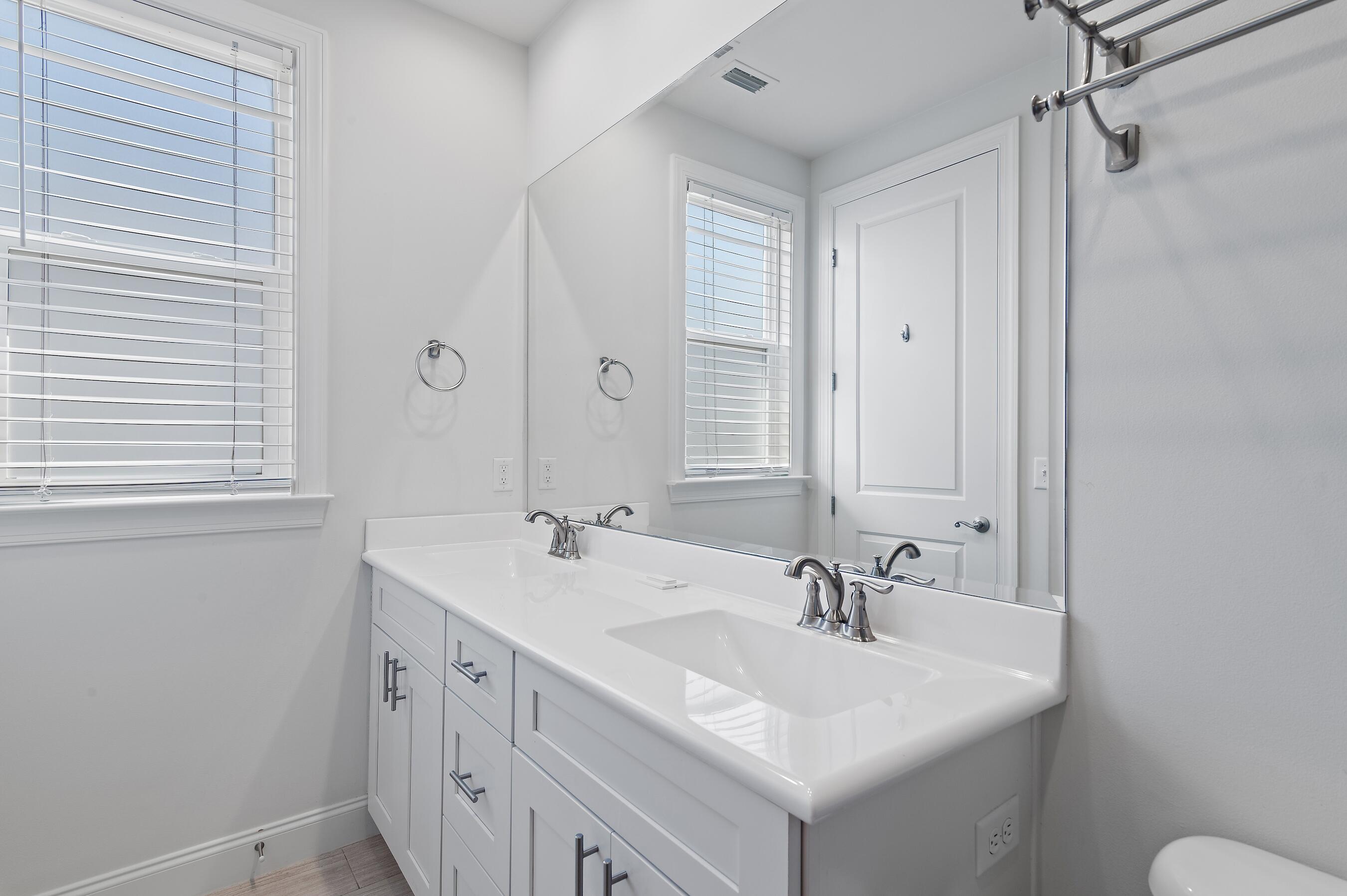 134 Hatton Court Santa Rosa Beach, FL 32459 - Photo 18 of 32 a bathroom with a sink and a mirror