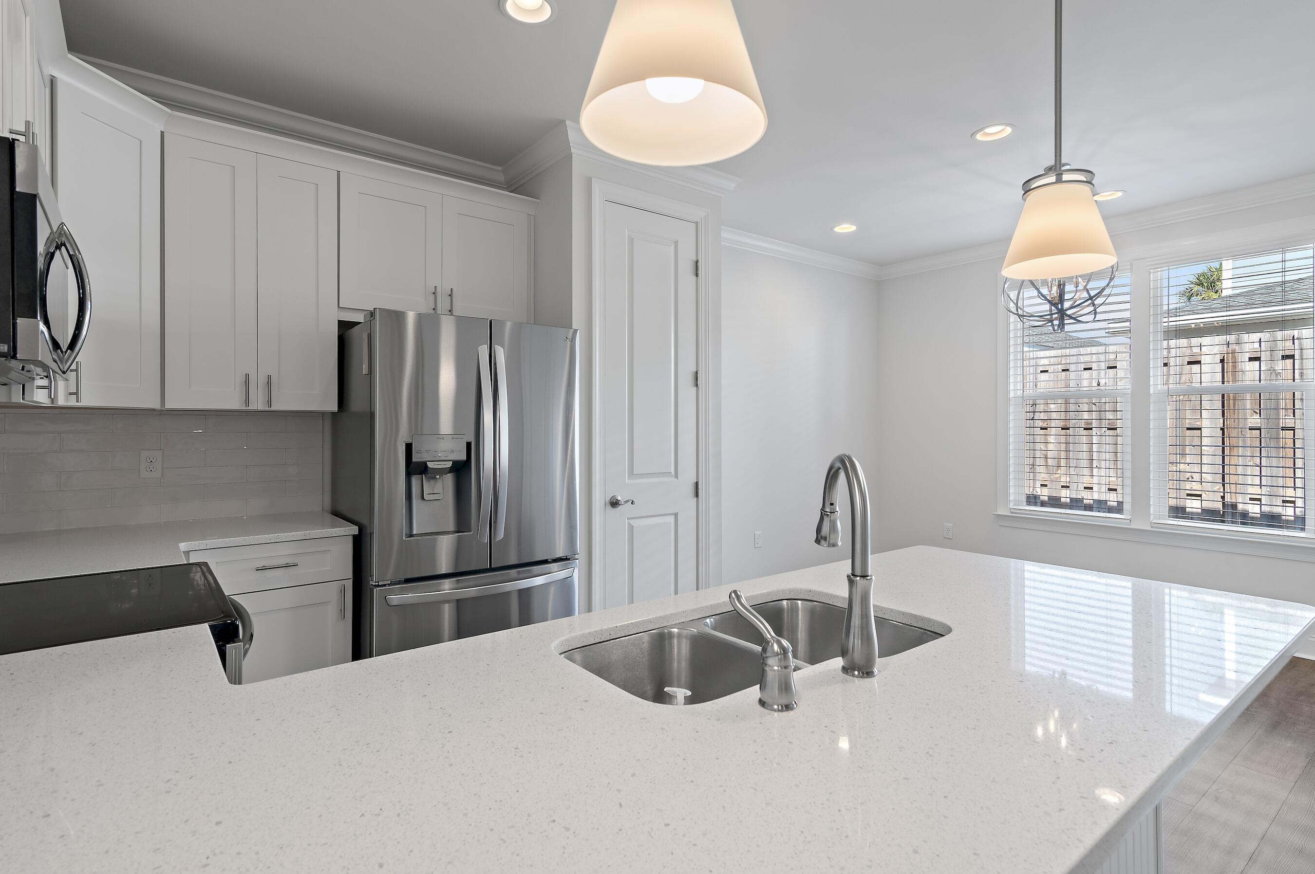 134 Hatton Court Santa Rosa Beach, FL 32459 - Photo 10 of 32 a kitchen with stainless steel appliances a sink and a refrigerator