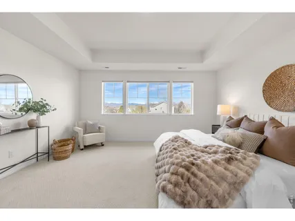 a bedroom with bed and a window