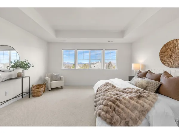 a bedroom with bed and a window