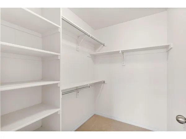 a view of an empty walk in closet
