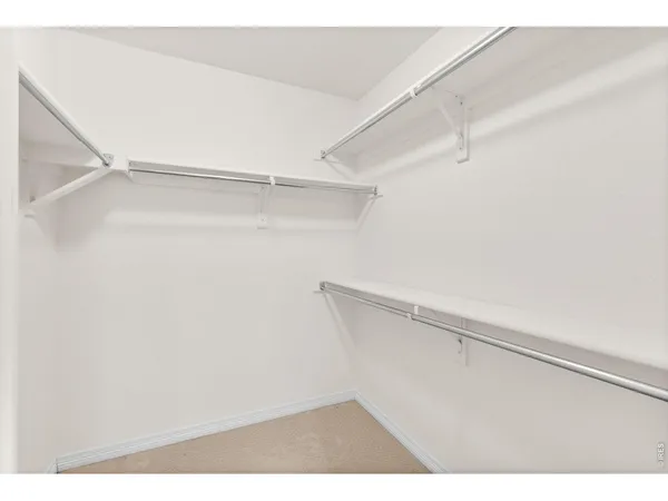 a view of an empty walk in closet