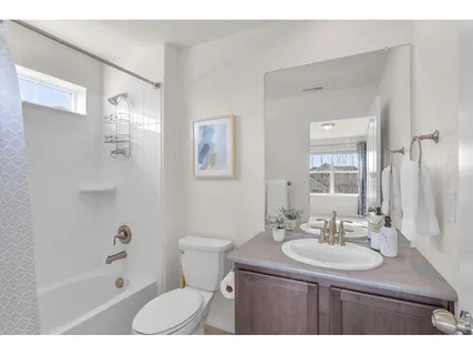 a bathroom with a sink toilet a shower and a mirror