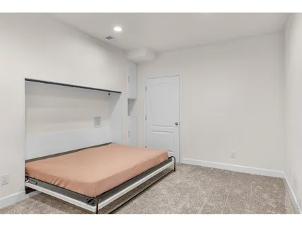a bedroom with a bed and a shower