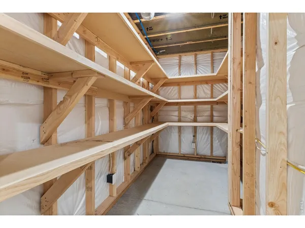 a view of staircase with white walls and a window